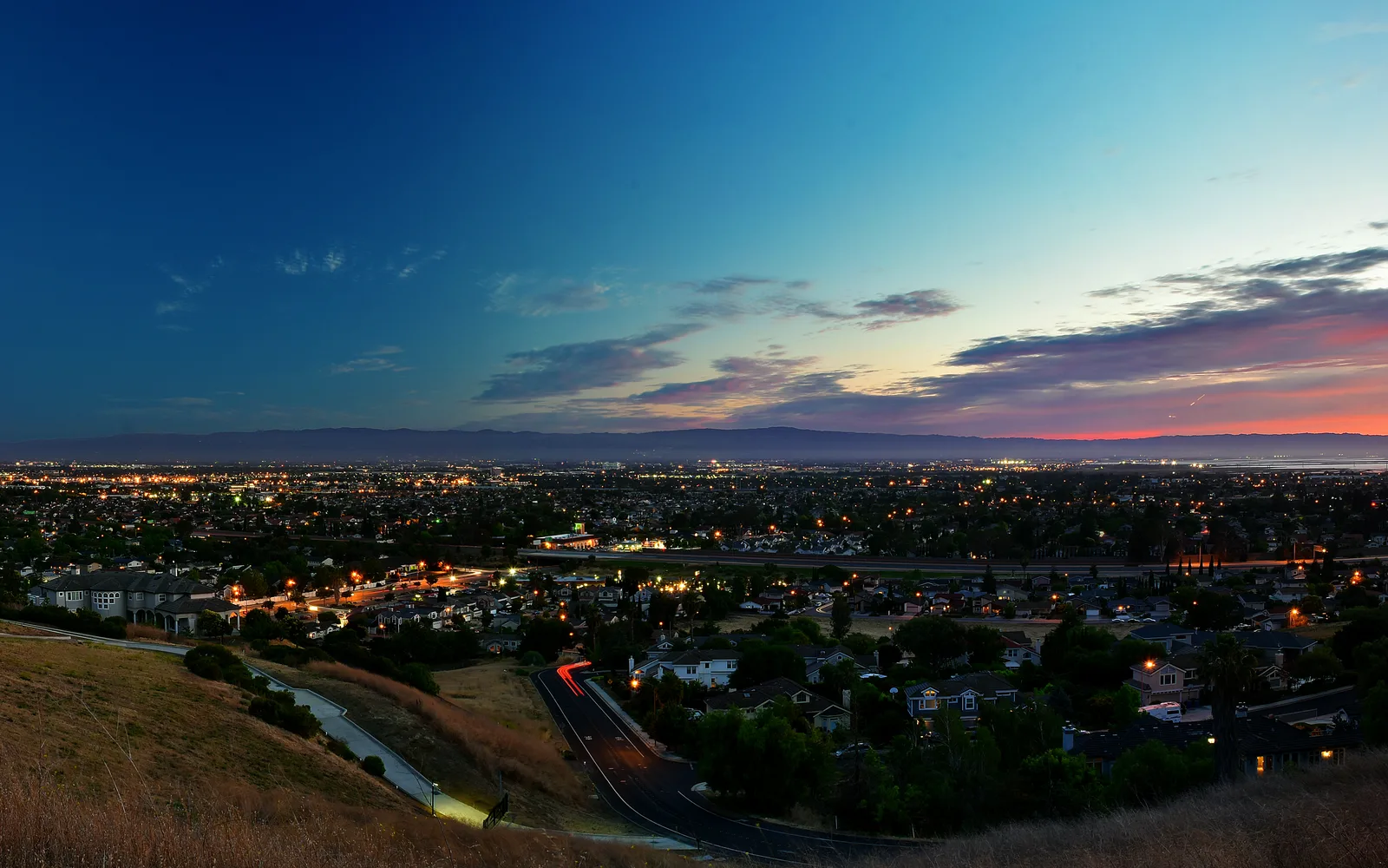 Sunset panorama over Silicon Valley during summer solstice, showcasing the technology hub landscape